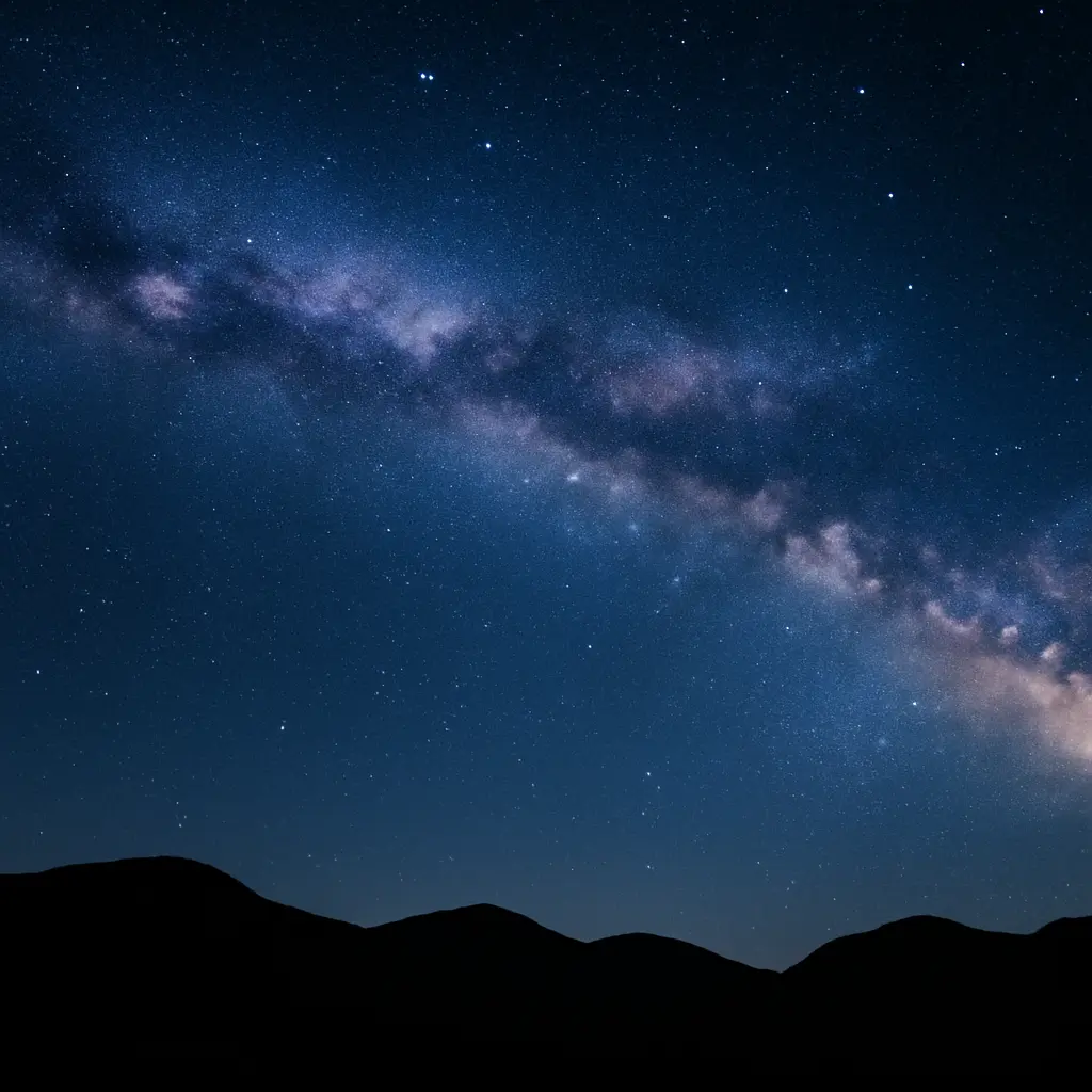 Milky Way arching over dark hills with clear stars